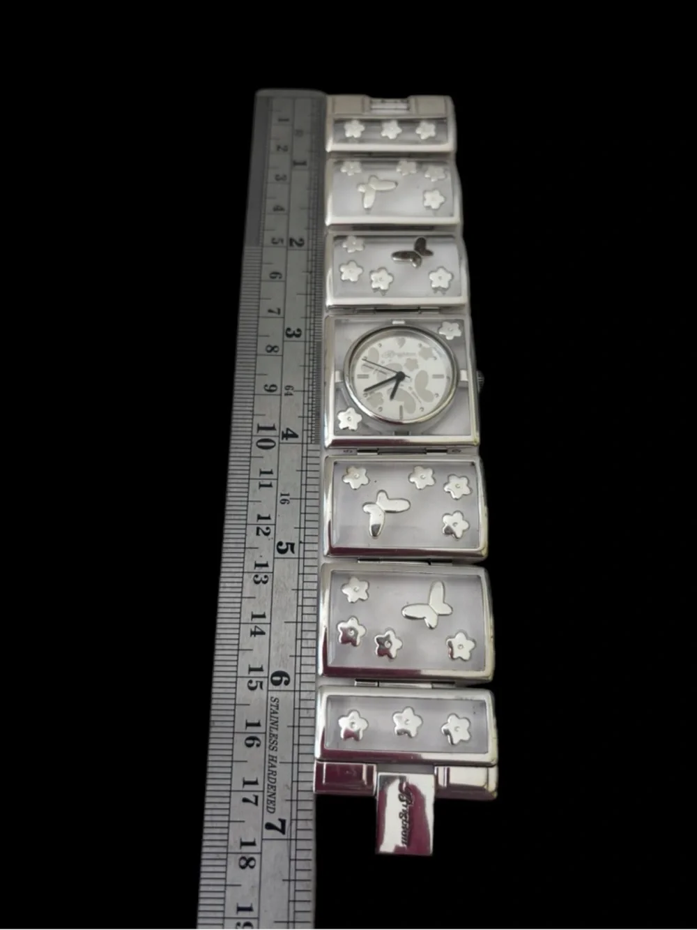 Brighton Gainesville watch features a design silver-tone butterflies & flowers.